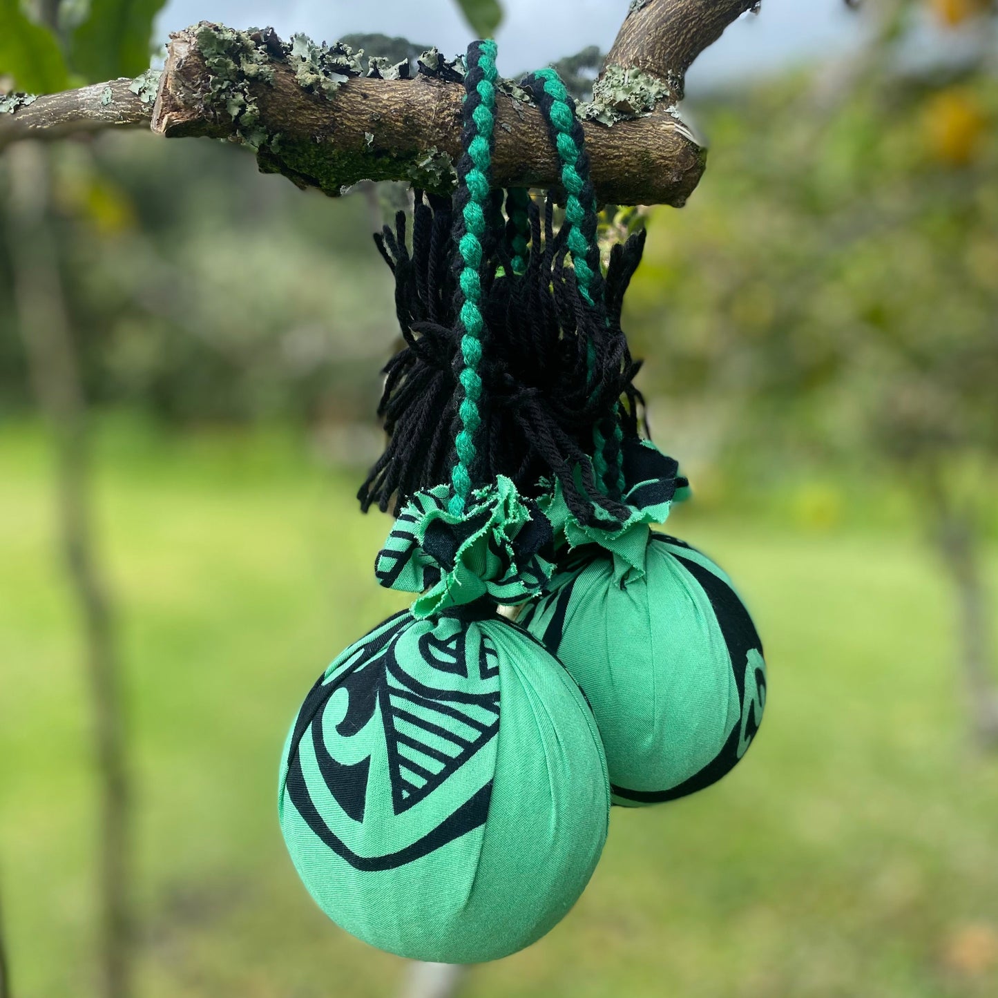 NZ Māori Poi Green Manawa Koru with Black & Green Braided Cord