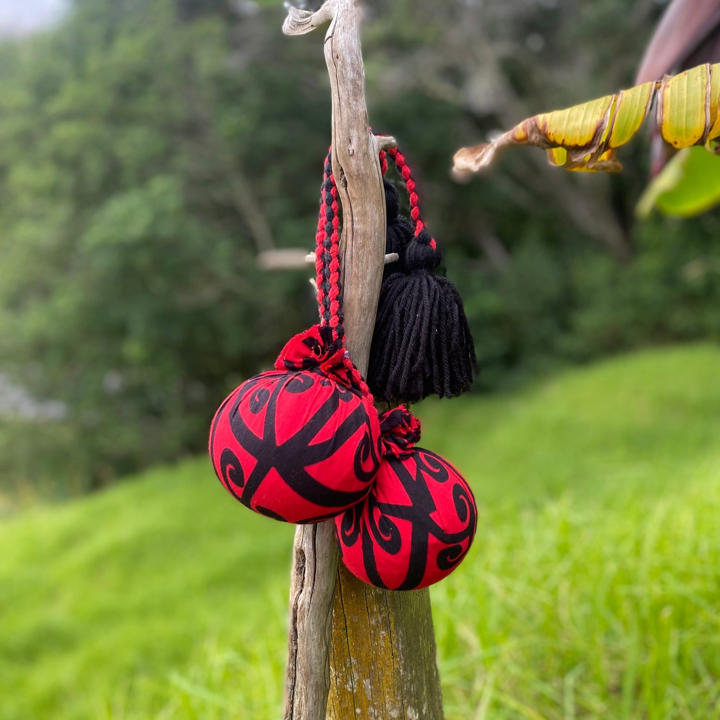 NZ Māori Poi Red Koru Rakau with Red & Black Braided Cord