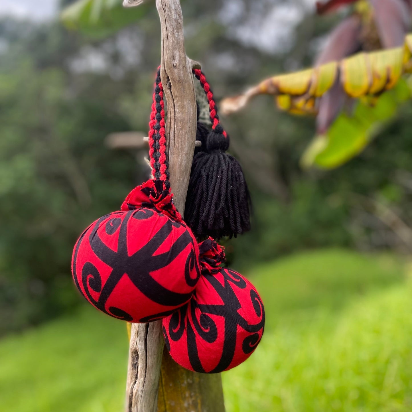 NZ Māori Poi Red Koru Rakau with Red & Black Braided Cord