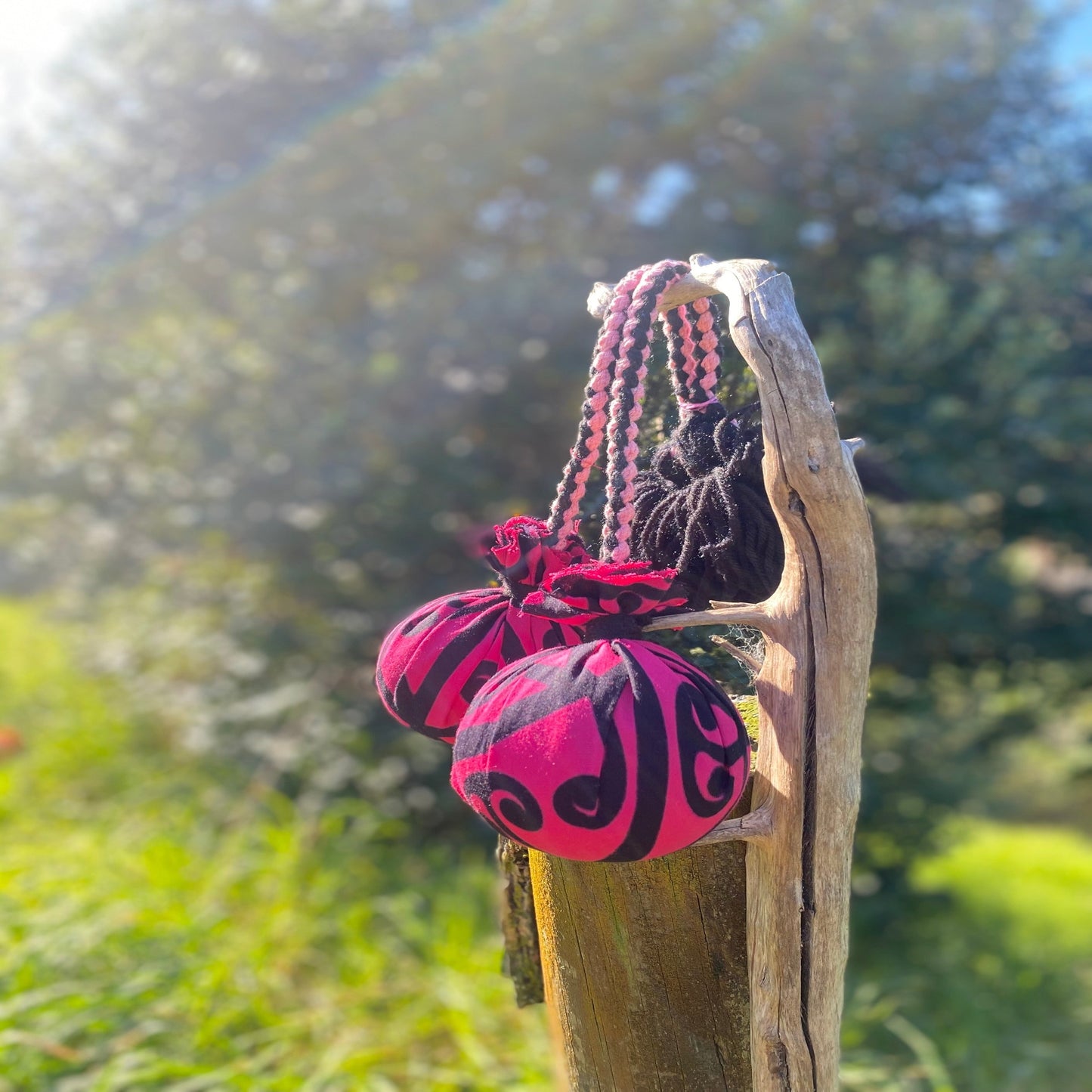 Poi Māori Pink Koru Rakau with pink & black Braided Cord
