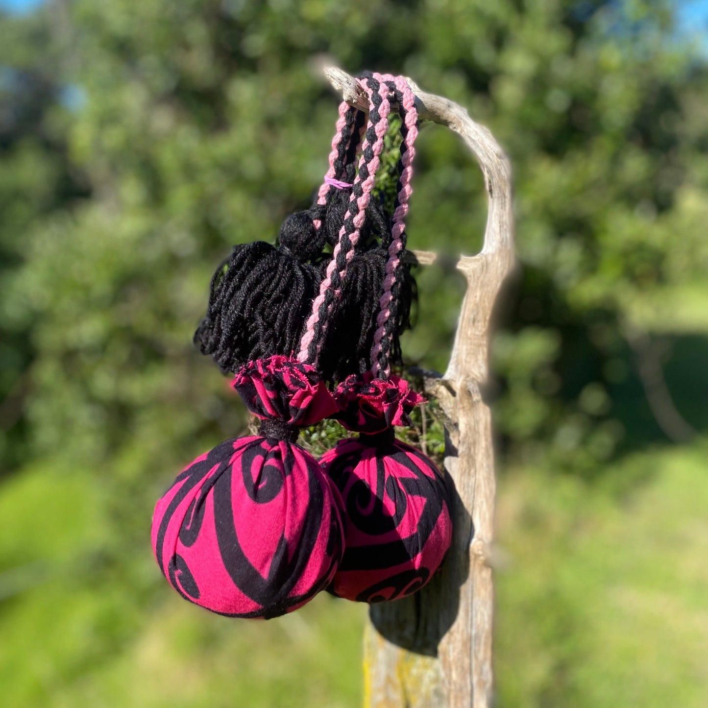 Māori Poi Pink Koru Rakau with pink & black Braided Cord