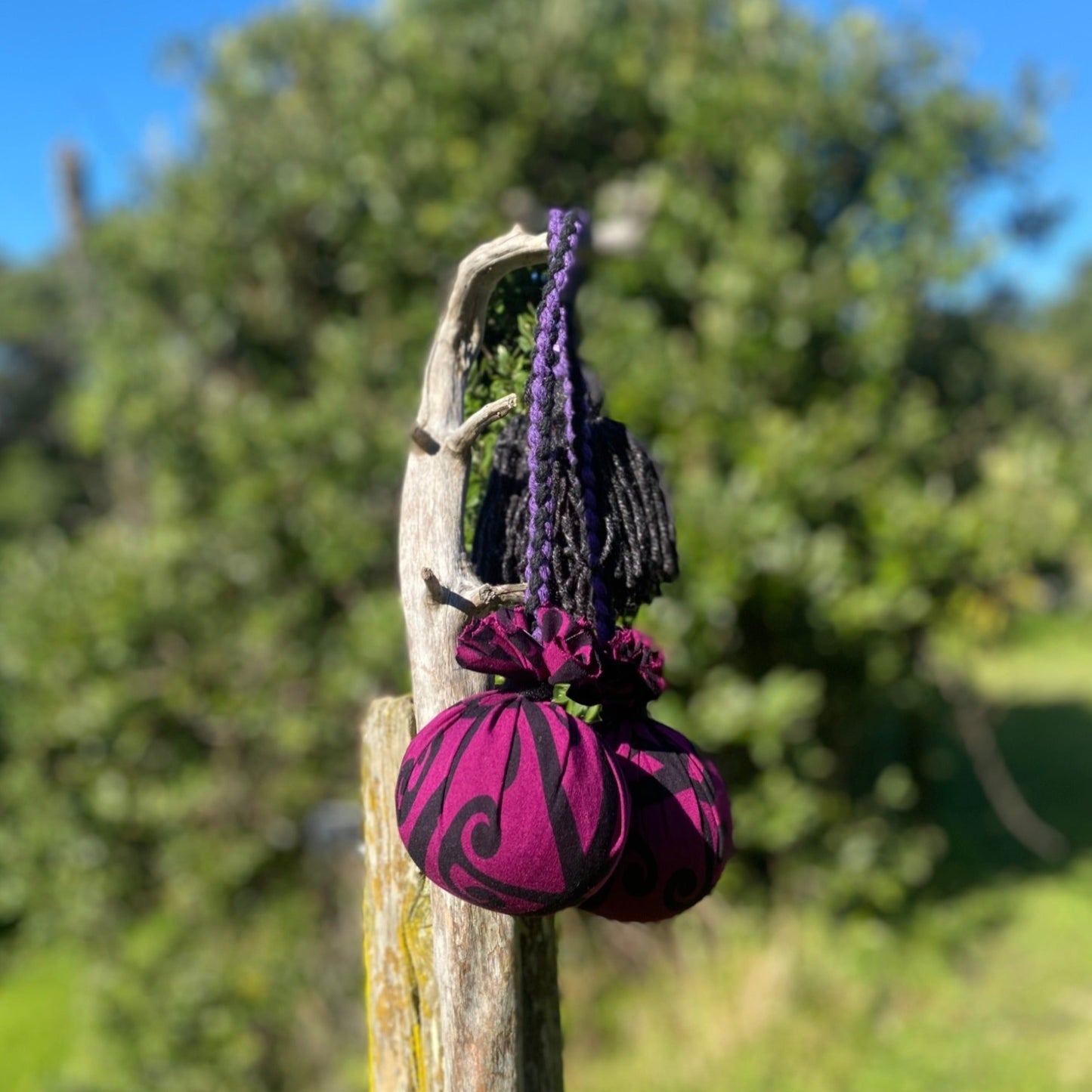 Māori Poi Purple Koru Rakau with purple & black Braided Cord