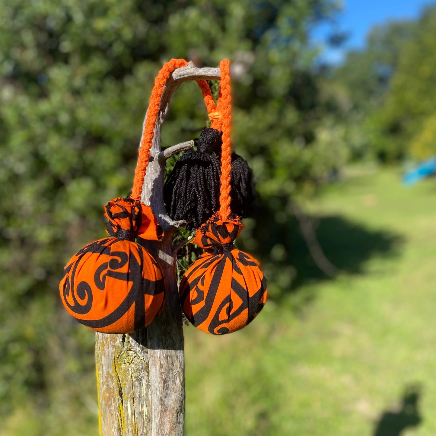 NZ Māori Poi Orange Koru Rakau with Orange Braided Cord