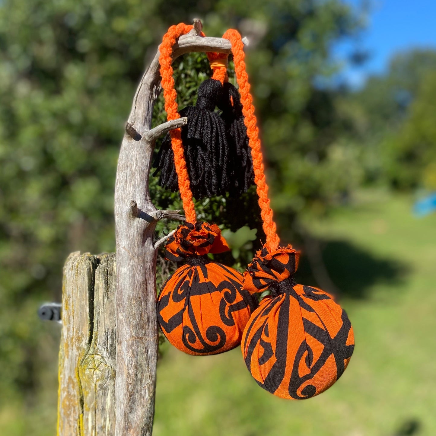 NZ Māori Poi Orange Koru Rakau with Orange Braided Cord