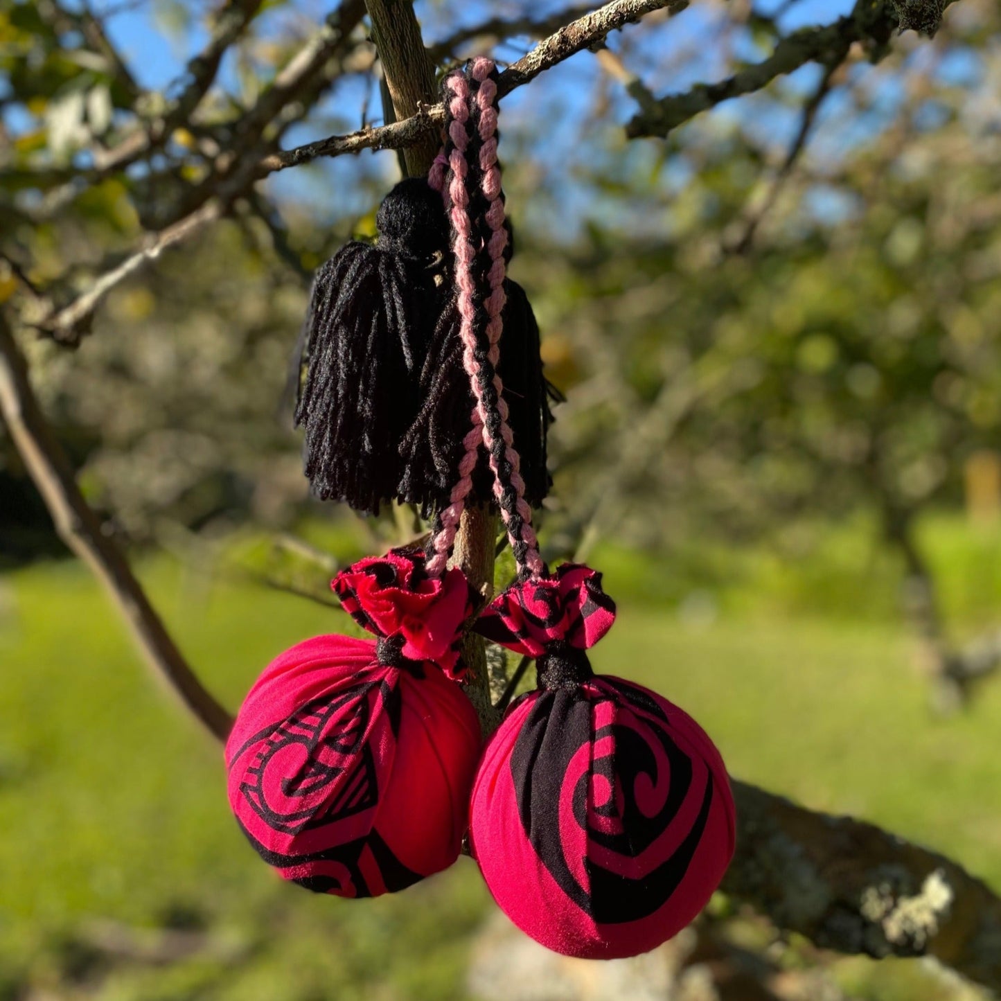 Māori Poi Pink Manawa Koru with pink & black Braided Cord