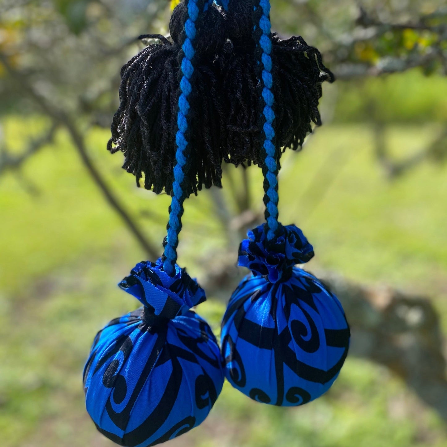 Māori Poi Blue Koru Rakau with Blue & Black Braided Cord