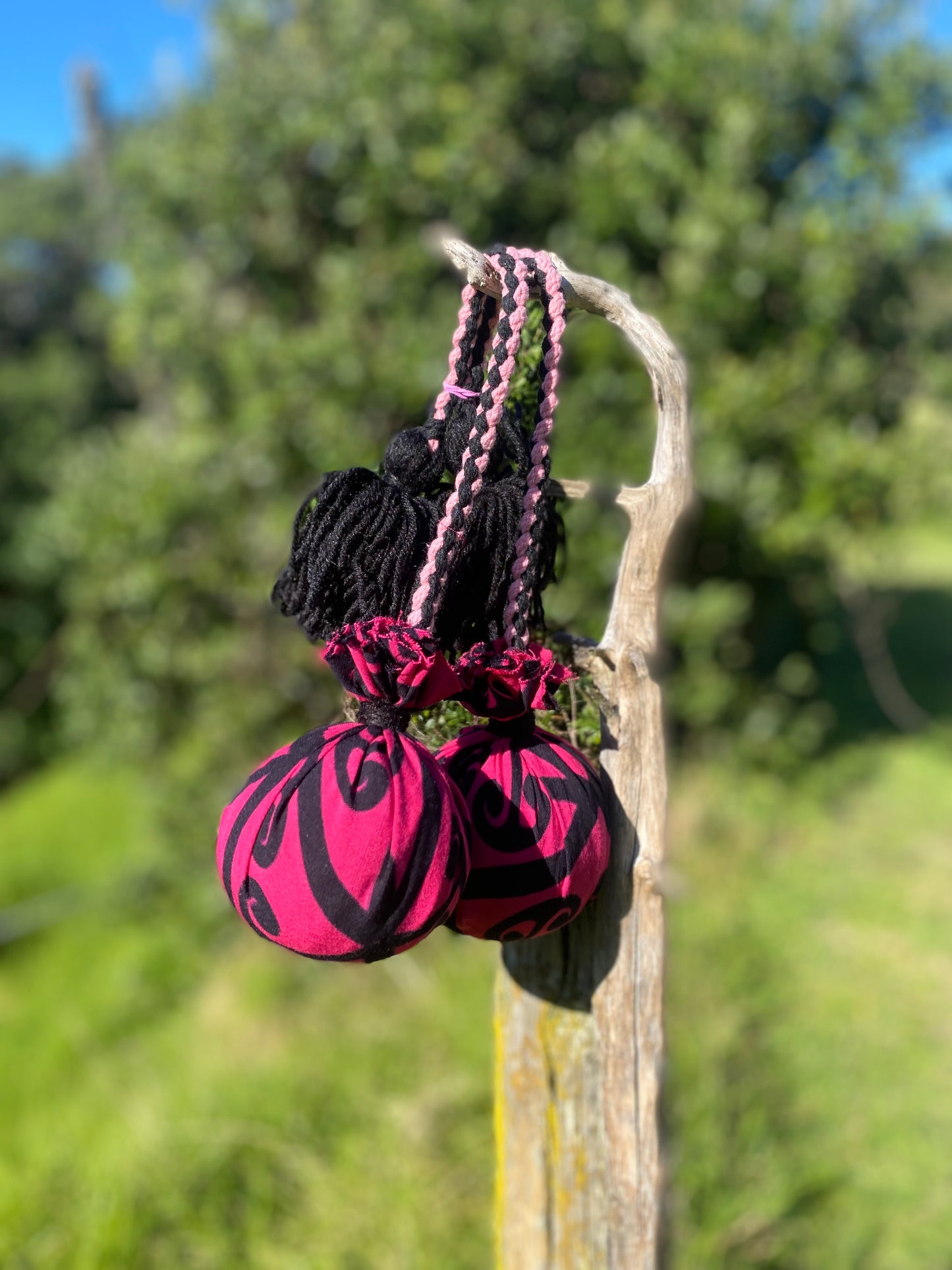 Māori Poi Pink Koru Rakau with pink & black Braided Cord