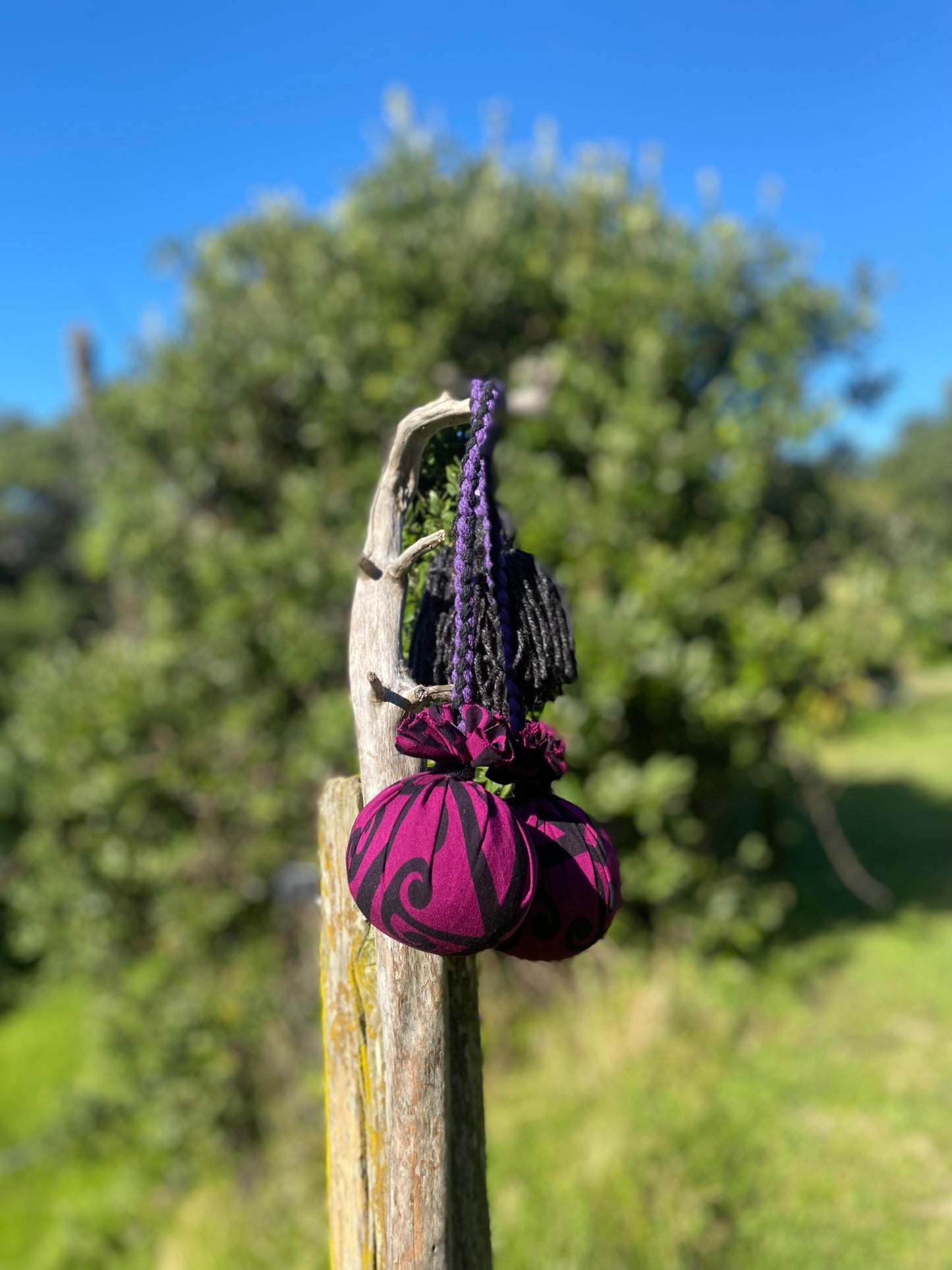 Māori Poi Purple Koru Rakau with purple & black Braided Cord