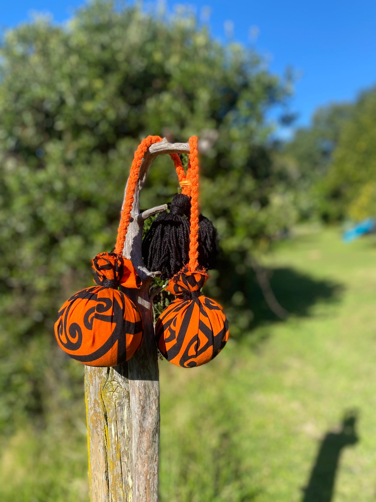NZ Māori Poi Orange Koru Rakau with Orange Braided Cord