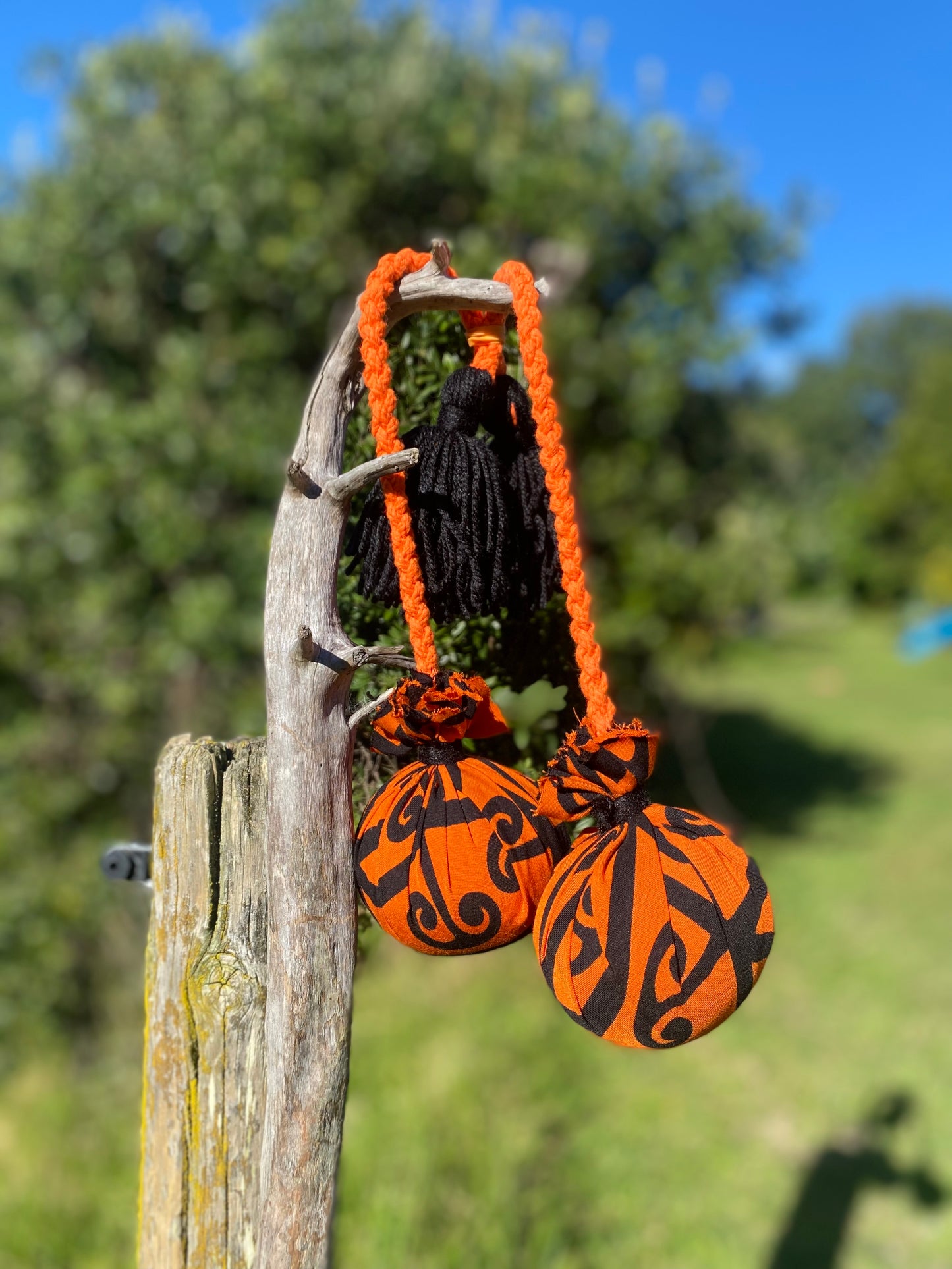 NZ Māori Poi Orange Koru Rakau with Orange Braided Cord