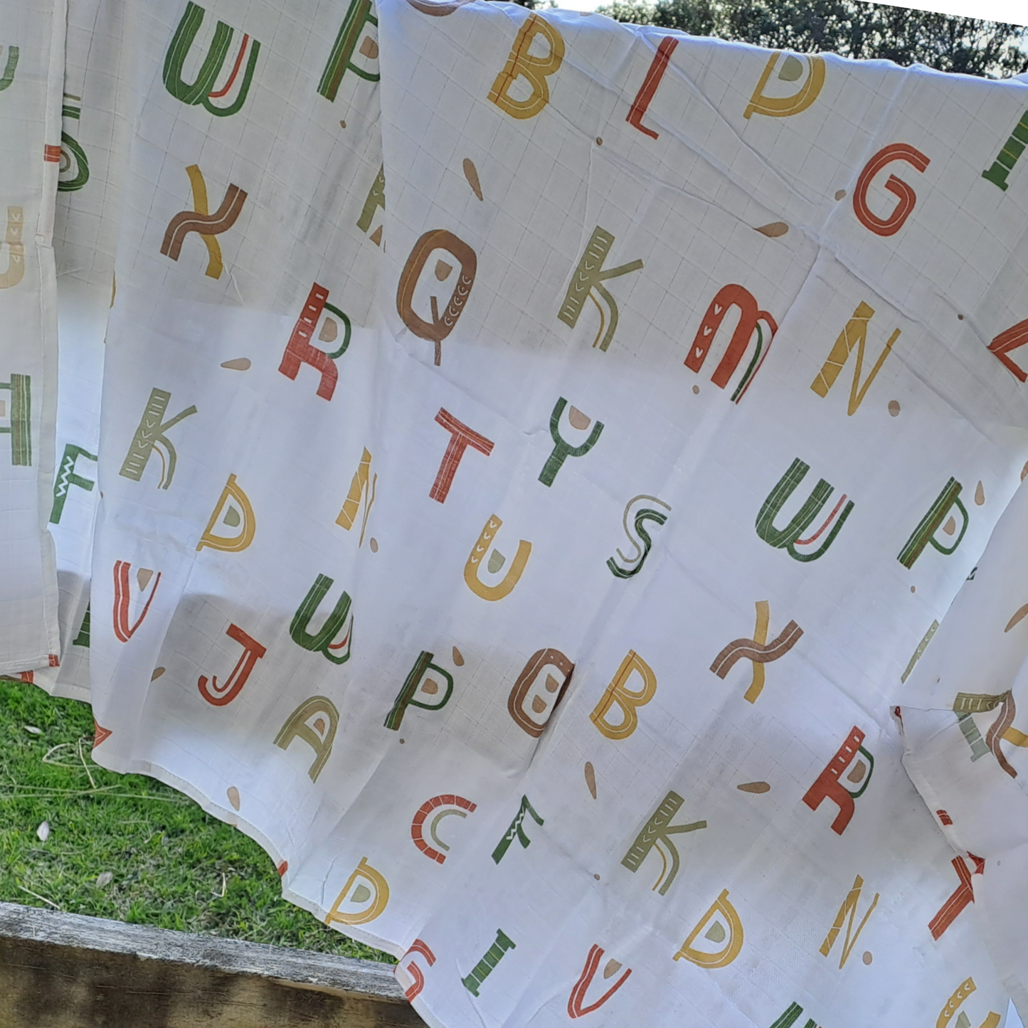Multi coloured baby gift set alphabet Swaddle